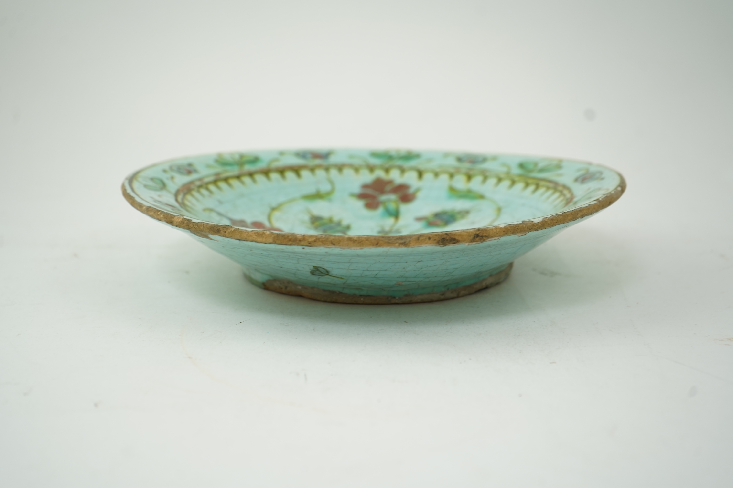 An Iznik pottery turquoise glazed dish, Ottoman Turkey, c.1650-1700